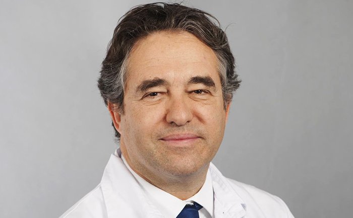 A person wearing a white uniform with a tie, representing professional cruise staff | MSC Cruises