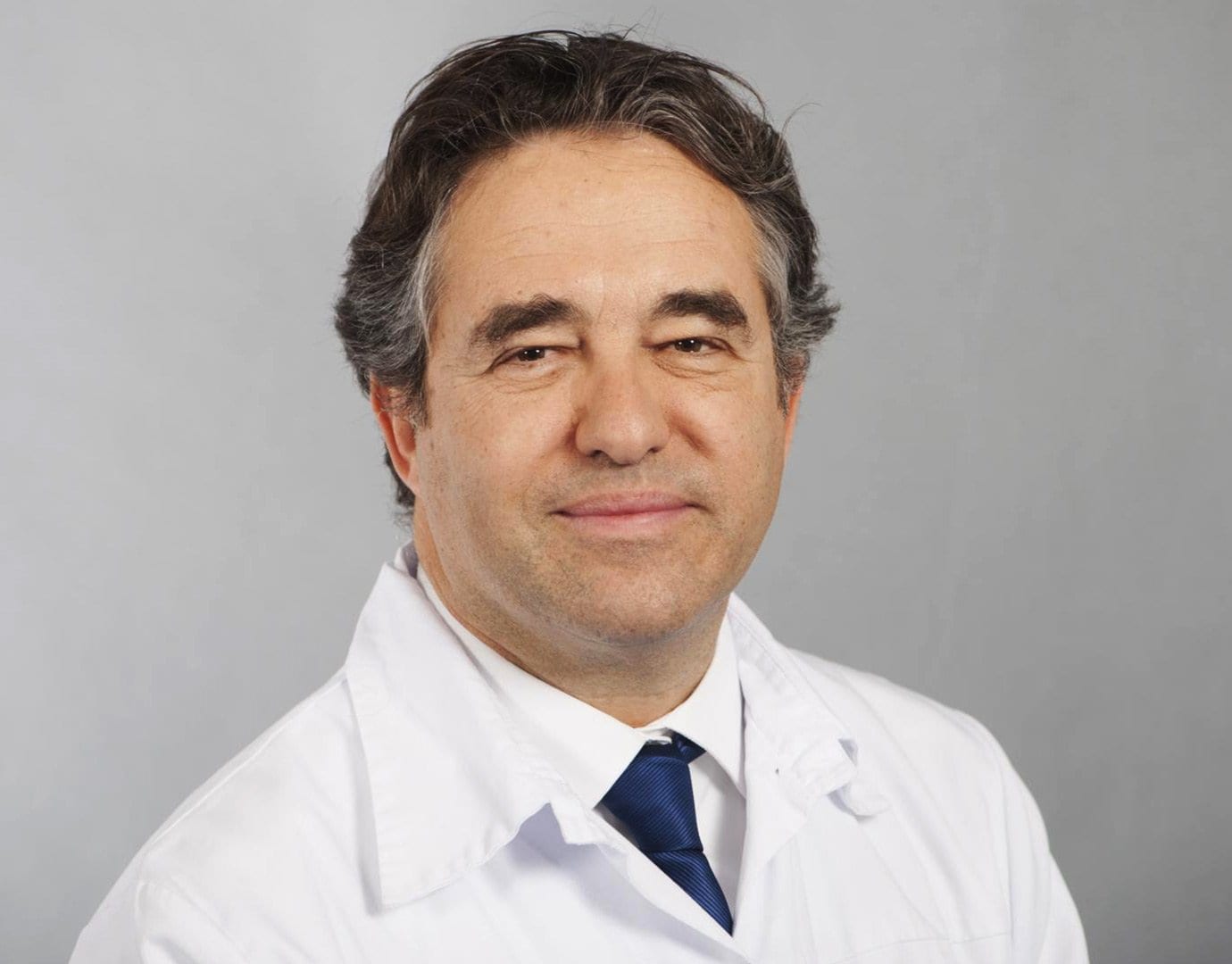 A professional in a white uniform with a blue tie | MSC Cruises A professional in a white uniform with a blue tie | MSC Cruises