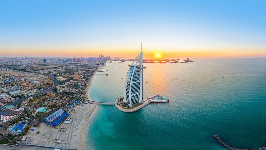 Dubai's iconic Burj Al Arab and coastline at sunset | MSC Cruises Dubai's iconic Burj Al Arab and coastline at sunset | MSC Cruises