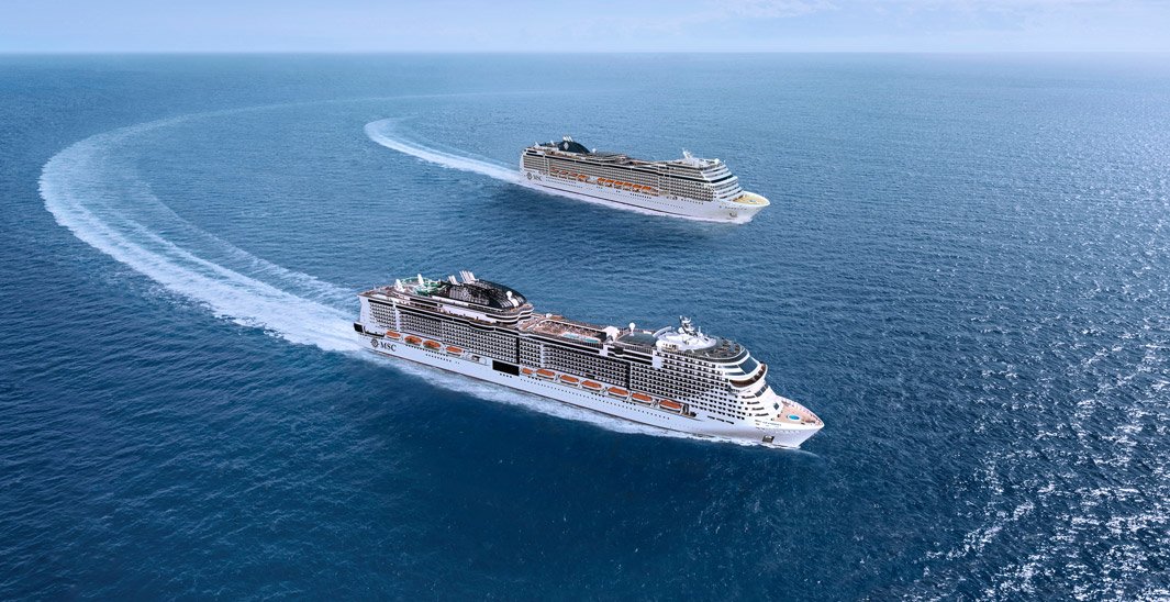 Two MSC cruise ships sailing in open blue waters | MSC Cruises