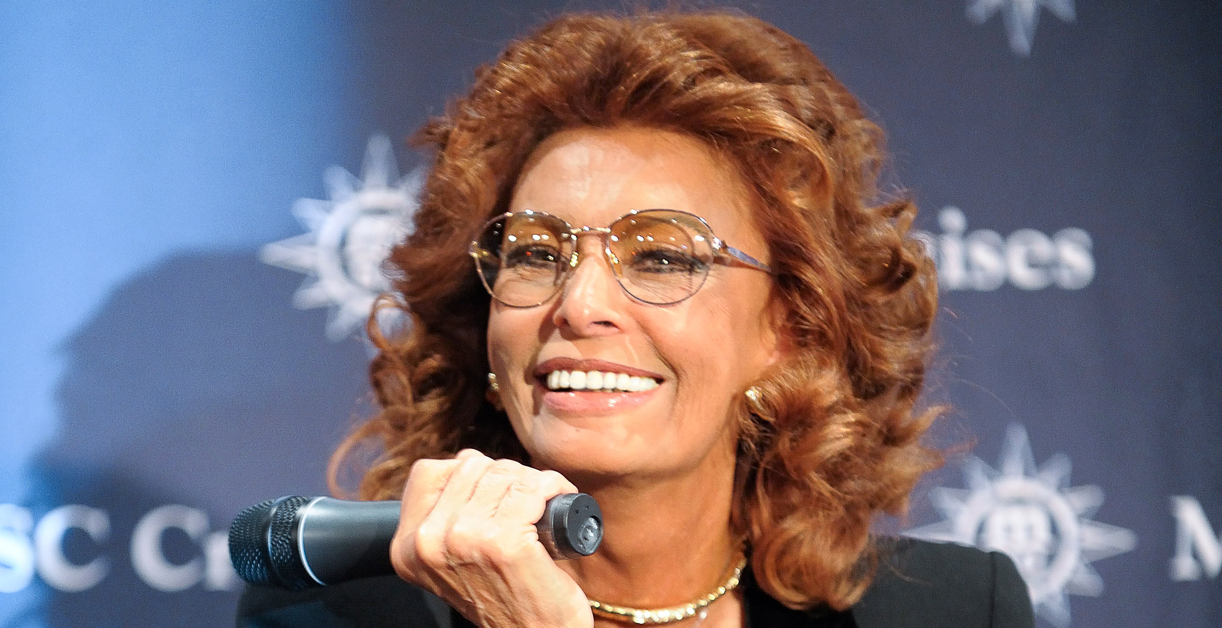 A person speaking into a microphone at an MSC Cruises event | MSC Cruises