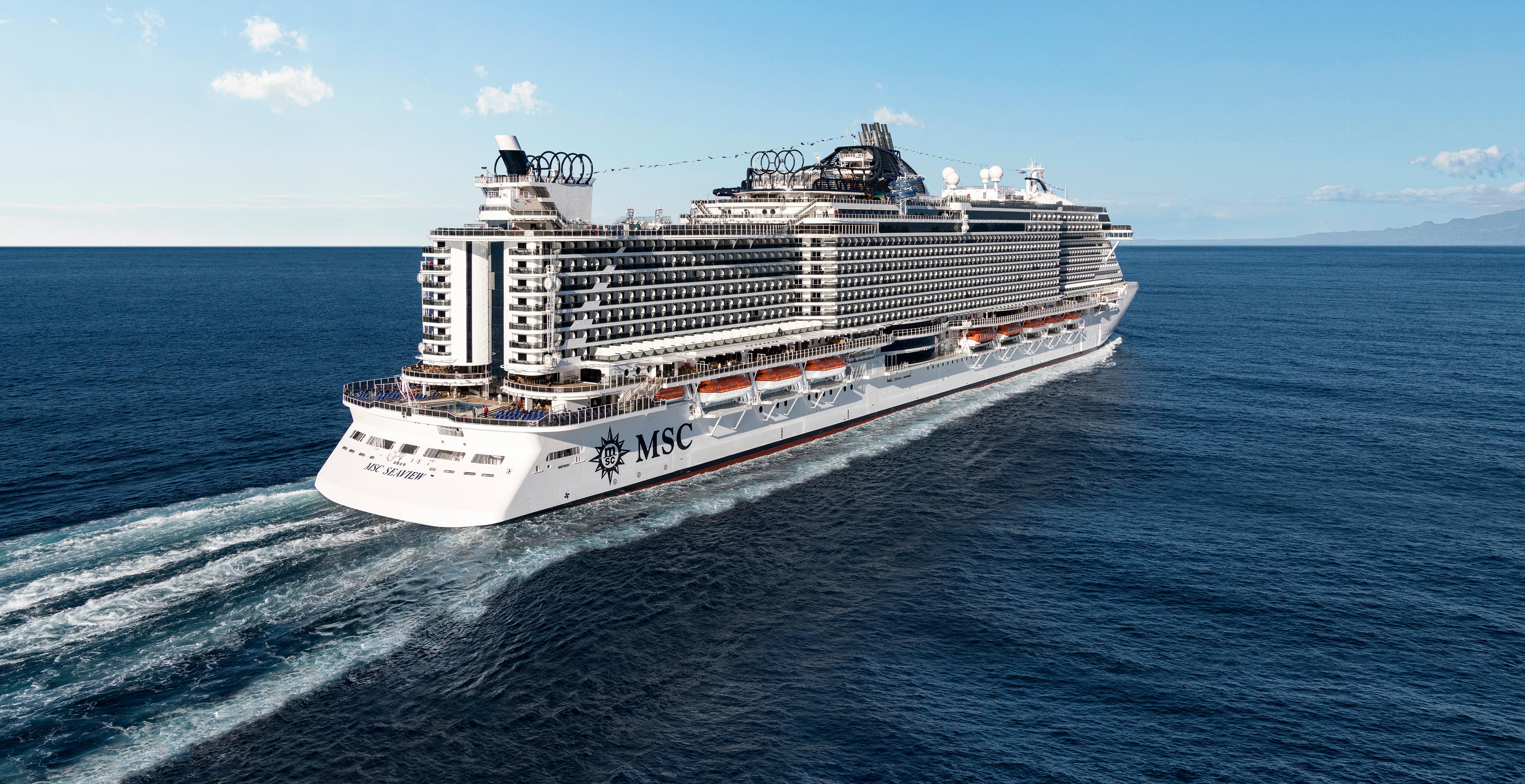 A large MSC cruise ship sailing on open blue waters under a clear sky | MSC Cruises