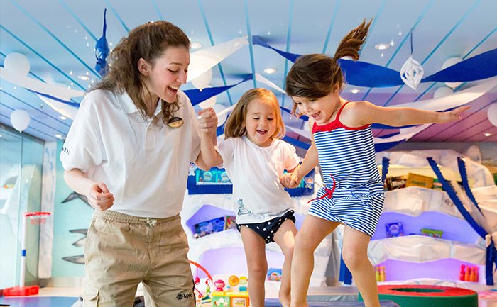 Children enjoying activities in a colorful MSC Kids Club onboard a cruise ship | MSC Cruises