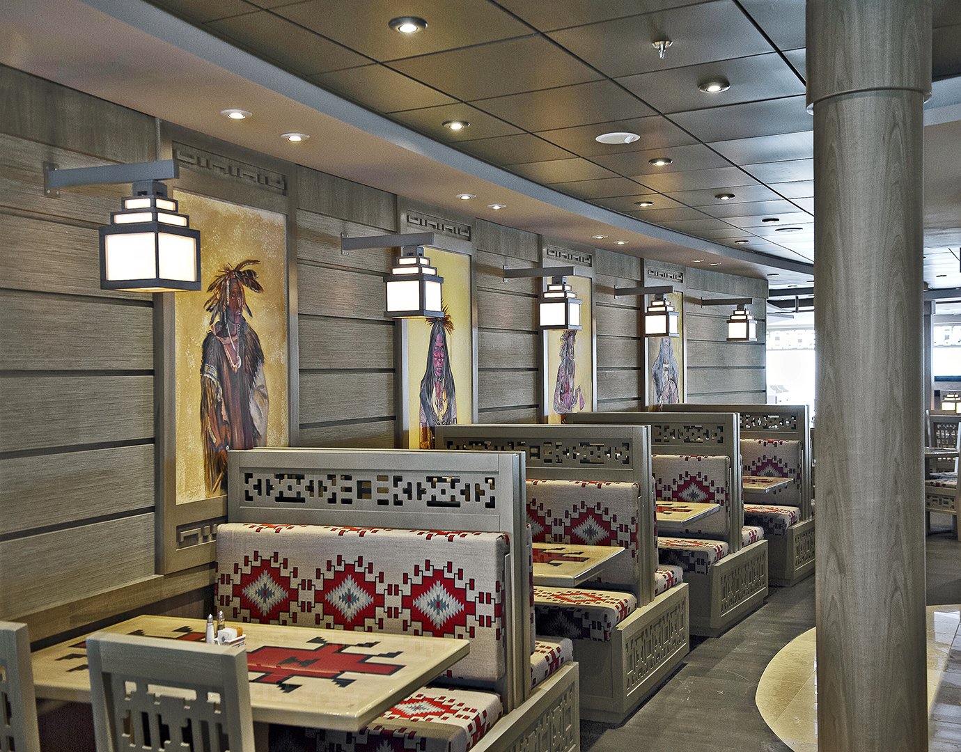 Cozy restaurant with Native American-inspired decor and patterned booth seating onboard | MSC Cruises Cozy restaurant with Native American-inspired decor and patterned booth seating onboard | MSC Cruises