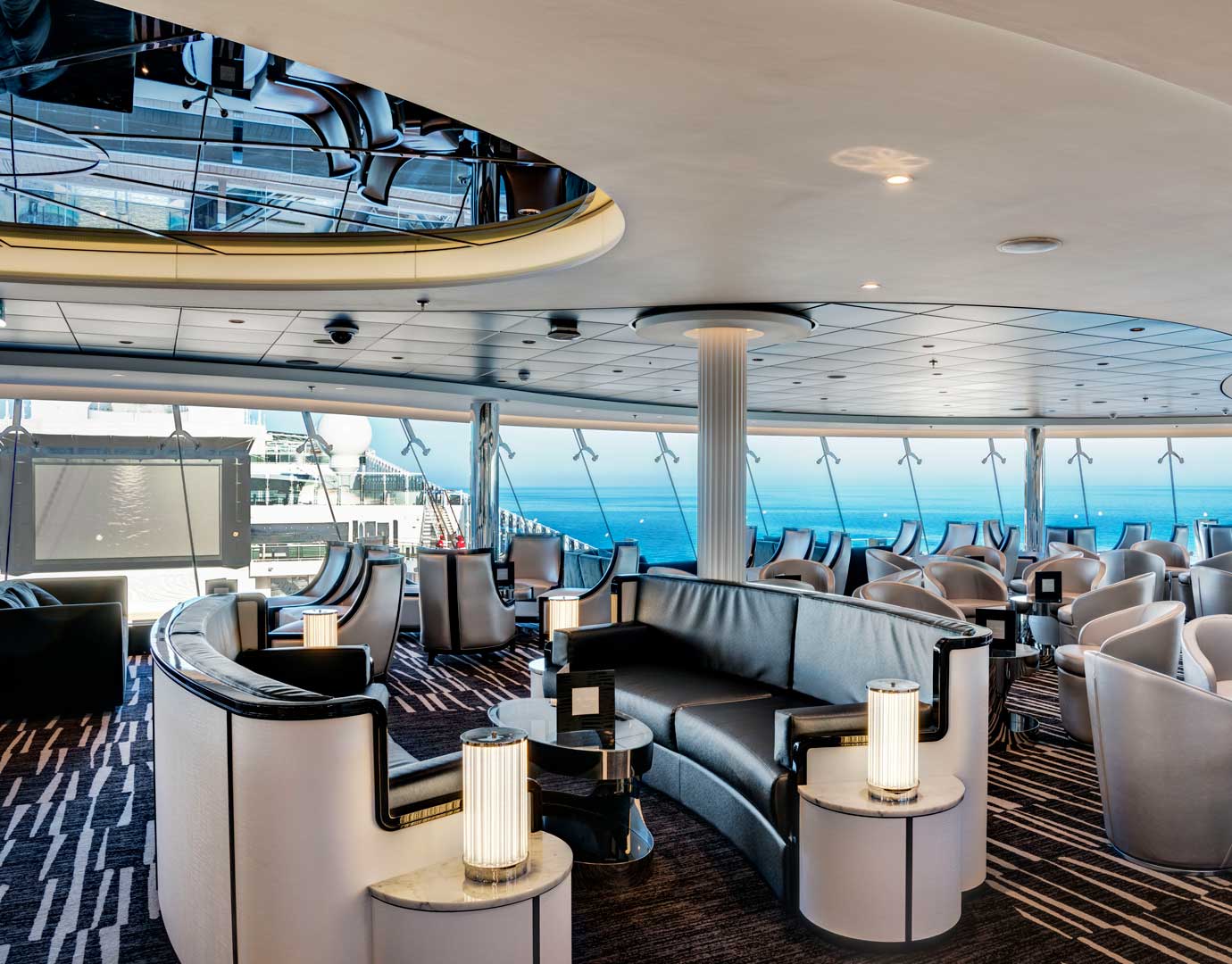 Luxurious lounge with ocean views and modern seating on an MSC cruise ship | MSC Cruises Luxurious lounge with ocean views and modern seating on an MSC cruise ship | MSC Cruises